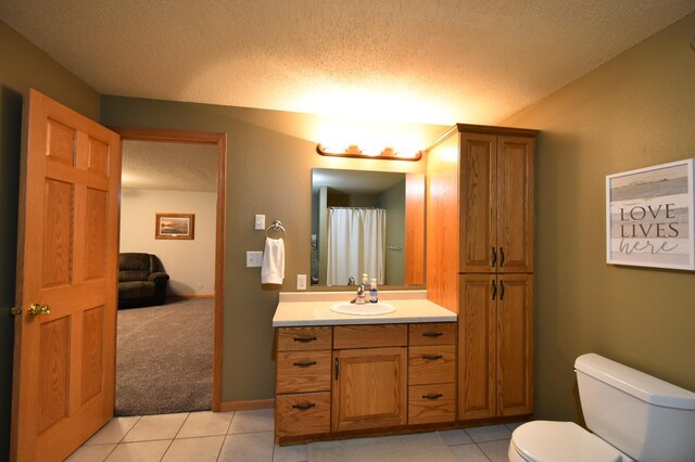 201 Ridge Dr, Kenyon, MN 55946 - full bath with a textured ceiling, vanity, toilet, tile patterned floors, and a shower with curtain