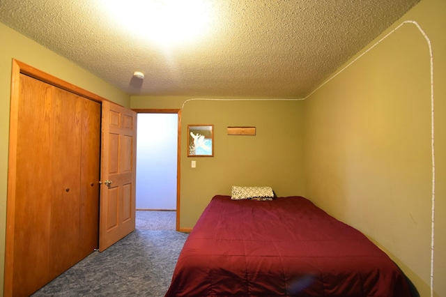 201 Ridge Dr, Kenyon, MN 55946 - carpeted bedroom with a textured ceiling and a closet
