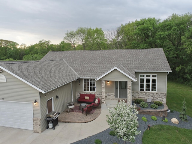 201 Ridge Dr, Kenyon, MN 55946 - single story home featuring outdoor lounge area, a shingled roof, and an attached garage
