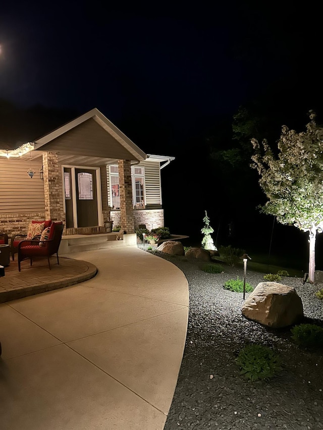 201 Ridge Dr, Kenyon, MN 55946 - view of front of home featuring a patio and brick siding