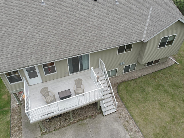 201 Ridge Dr, Kenyon, MN 55946 - rear view of property featuring a shingled roof, stairway, and a wooden deck