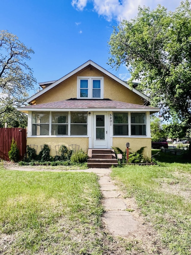 5801 Colfax Ave N, Brooklyn Center, MN 55430 - bungalow-style home with stucco siding and entry steps