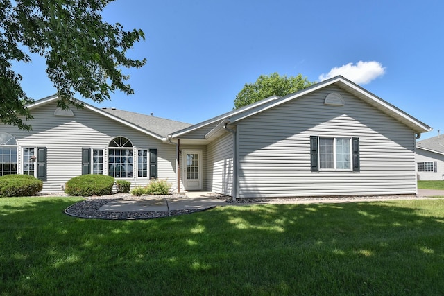11023 57th St NE, Albertville, MN 55301 - rear view of house featuring a patio area and a lawn