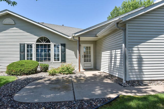 11023 57th St NE, Albertville, MN 55301 - rear view of property with a patio area and roof with shingles