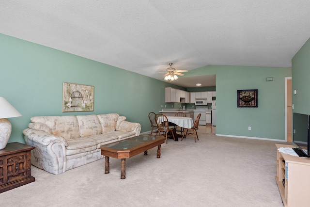 11023 57th St NE, Albertville, MN 55301 - living area featuring ceiling fan, vaulted ceiling, and light carpet