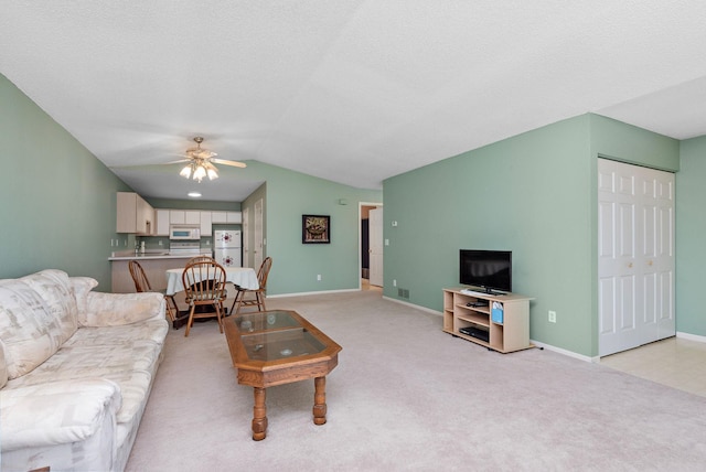 11023 57th St NE, Albertville, MN 55301 - living room with a ceiling fan, lofted ceiling, and light carpet