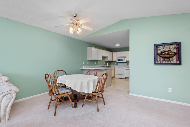 11023 57th St NE, Albertville, MN 55301 - dining room featuring lofted ceiling, light colored carpet, and a ceiling fan