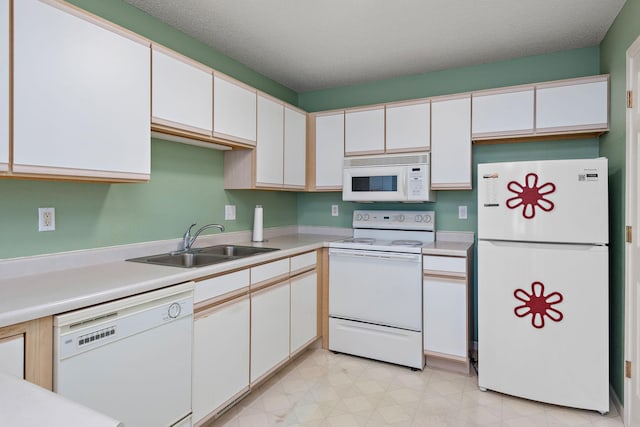 11023 57th St NE, Albertville, MN 55301 - kitchen with white appliances, light countertops, and white cabinets