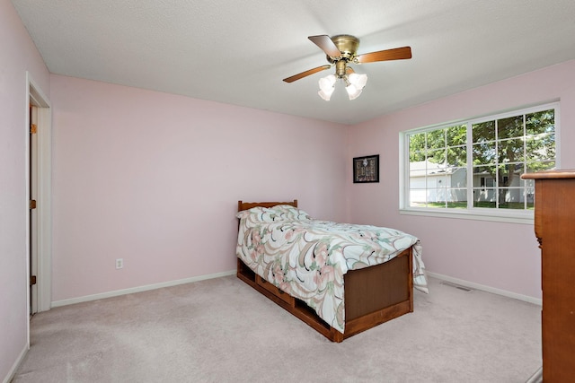 11023 57th St NE, Albertville, MN 55301 - carpeted bedroom featuring baseboards and ceiling fan