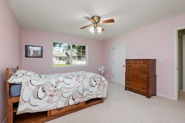 11023 57th St NE, Albertville, MN 55301 - carpeted bedroom with a ceiling fan and baseboards
