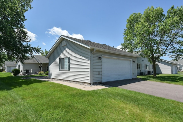 11023 57th St NE, Albertville, MN 55301 - view of home's exterior with an attached garage, driveway, and a lawn