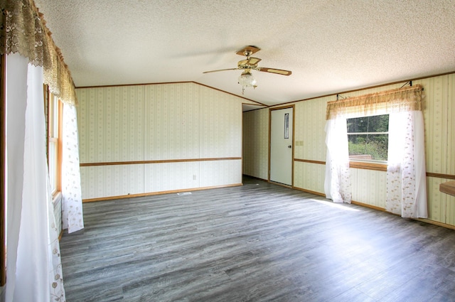 3146 Green Bay Rd, Sturgeon Lake, MN 55783 - unfurnished room featuring wood finished floors, a ceiling fan, wallpapered walls, a textured ceiling, and crown molding