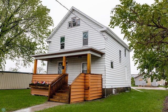 726 College St N, Fargo, ND 58102 - traditional style home featuring a front lawn, covered porch, and stairs