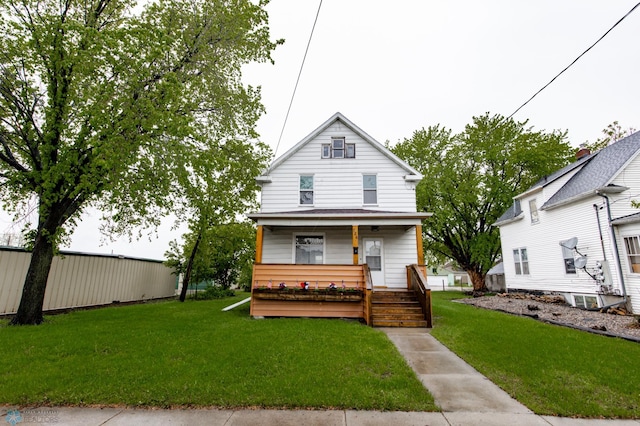 726 College St N, Fargo, ND 58102 - view of front of property with a porch and a front lawn