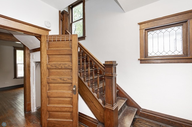 726 College St N, Fargo, ND 58102 - stairway with healthy amount of natural light and hardwood / wood-style floors