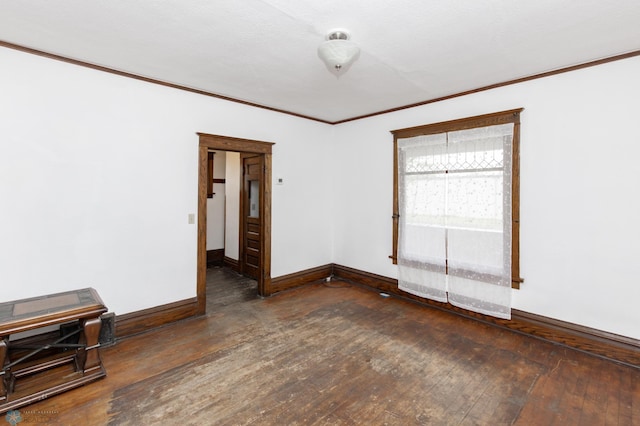 726 College St N, Fargo, ND 58102 - spare room with wood-type flooring, baseboards, and crown molding