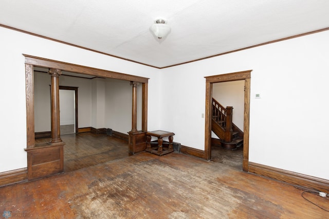 726 College St N, Fargo, ND 58102 - empty room featuring crown molding, hardwood / wood-style floors, and baseboards
