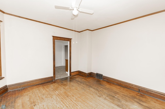 726 College St N, Fargo, ND 58102 - unfurnished room with wood-type flooring, baseboards, crown molding, and ceiling fan