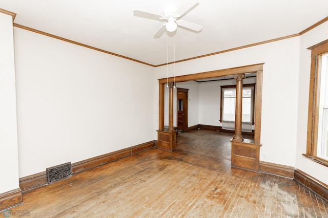 726 College St N, Fargo, ND 58102 - empty room with baseboards, wood-type flooring, a ceiling fan, and ornamental molding