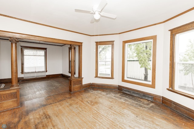 726 College St N, Fargo, ND 58102 - spare room featuring hardwood / wood-style floors, healthy amount of natural light, ceiling fan, baseboards, and ornamental molding