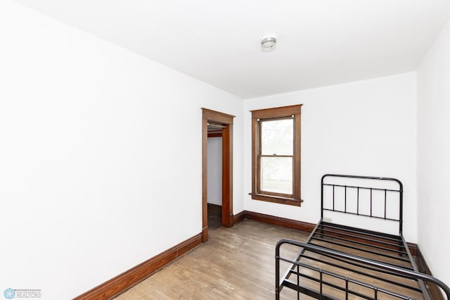 726 College St N, Fargo, ND 58102 - unfurnished bedroom with light wood-style floors and baseboards