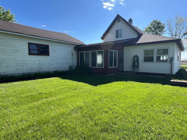 404 1st St S, Hoffman, MN 56339 - back of house featuring a yard and a chimney