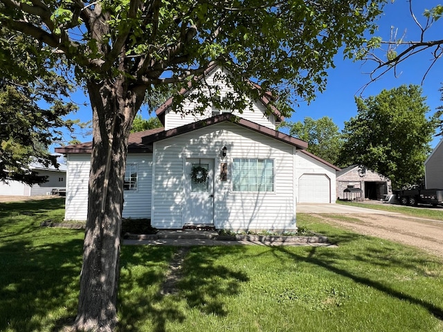 404 1st St S, Hoffman, MN 56339 - view of front of home featuring driveway, a front lawn, and an attached garage