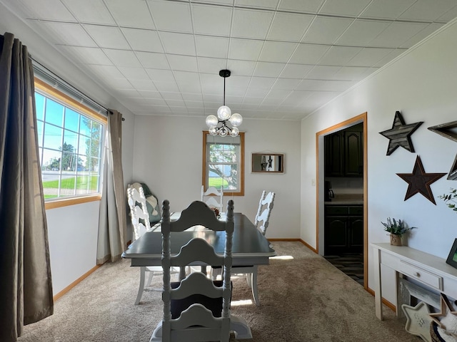 404 1st St S, Hoffman, MN 56339 - carpeted dining area featuring healthy amount of natural light, a chandelier, and baseboards
