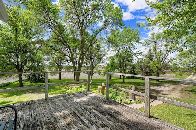 7149 92nd Ave SW, Lemond Twp, MN 56026 - wooden deck featuring a lawn