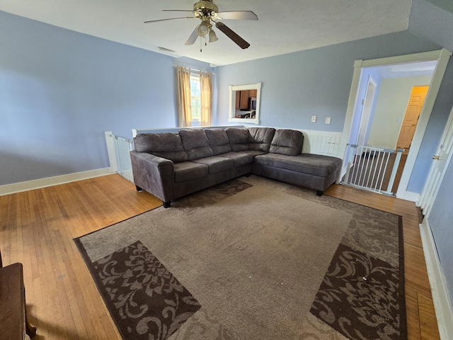 21824 County Highway 20, Lake Eunice Twp, MN 56501 - living area featuring a ceiling fan, wood finished floors, and baseboards
