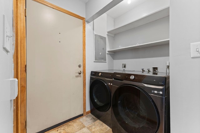 832 Woodgate Dr Unit 107, Vadnais Heights, MN 55127 - washroom with washer and dryer, electric panel, light stone finish flooring, and baseboards