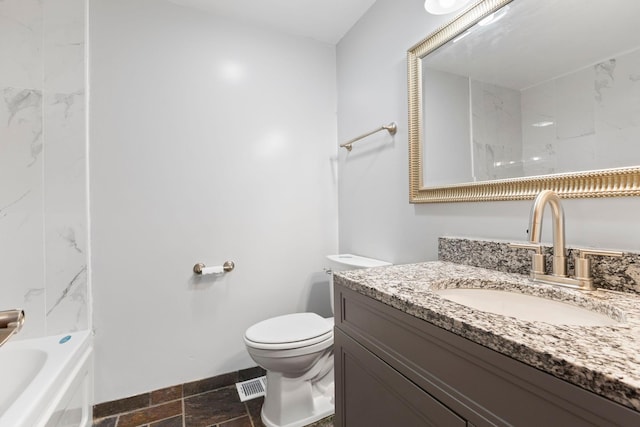 832 Woodgate Dr Unit 107, Vadnais Heights, MN 55127 - bathroom with vanity, toilet, baseboards, shower / bathtub combination, and stone tile floors
