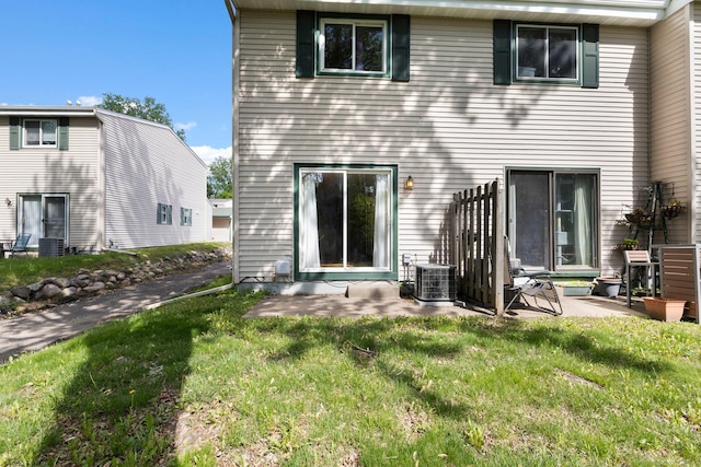 832 Woodgate Dr Unit 107, Vadnais Heights, MN 55127 - back of property featuring a patio, a lawn, and cooling unit