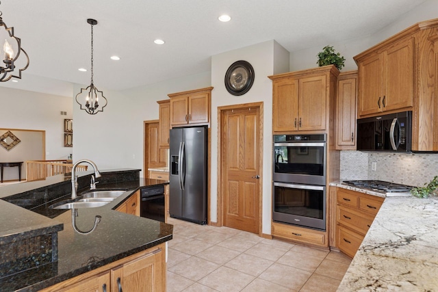 11565 Palisade Ct NE, Blaine, MN 55449 - kitchen with black appliances, a chandelier, decorative backsplash, dark stone countertops, and decorative light fixtures