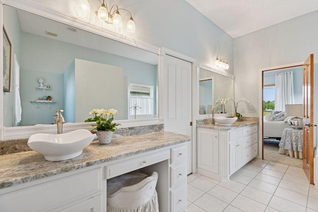 11565 Palisade Ct NE, Blaine, MN 55449 - ensuite bathroom featuring tile patterned flooring, vanity, and a chandelier