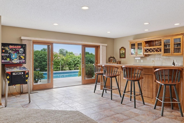 11565 Palisade Ct NE, Blaine, MN 55449 - indoor wet bar featuring recessed lighting, healthy amount of natural light, and a textured ceiling