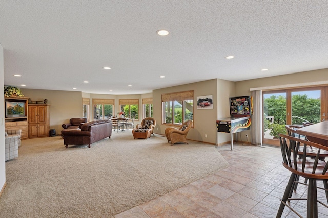 11565 Palisade Ct NE, Blaine, MN 55449 - living room with recessed lighting, a textured ceiling, and light stone finish floors