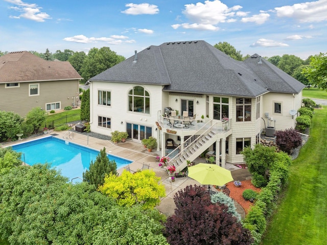 11565 Palisade Ct NE, Blaine, MN 55449 - rear view of property with a patio, a fenced backyard, stairs, a shingled roof, and a deck