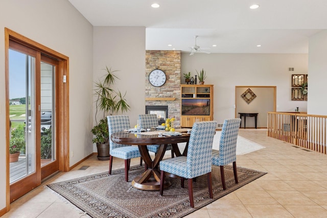 11565 Palisade Ct NE, Blaine, MN 55449 - dining space with a ceiling fan, light tile patterned flooring, a fireplace, and recessed lighting