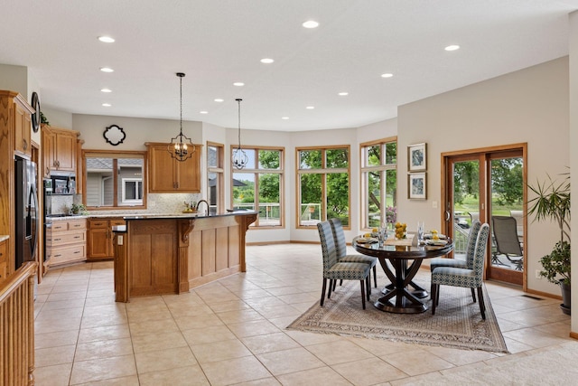 11565 Palisade Ct NE, Blaine, MN 55449 - dining space with recessed lighting, light tile patterned floors, and a chandelier