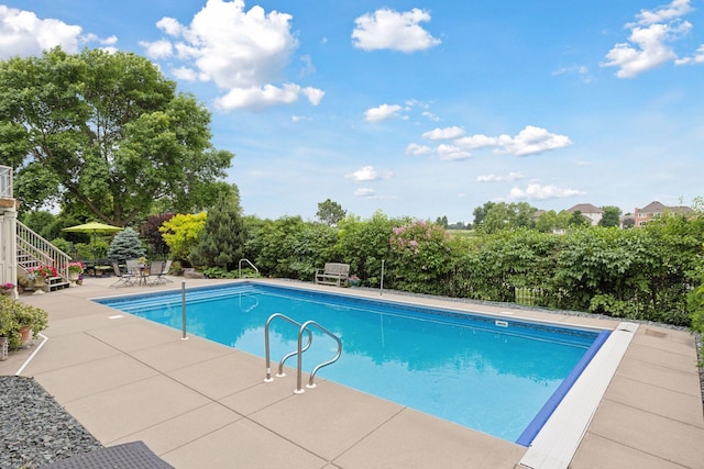 11565 Palisade Ct NE, Blaine, MN 55449 - swimming pool featuring a patio area