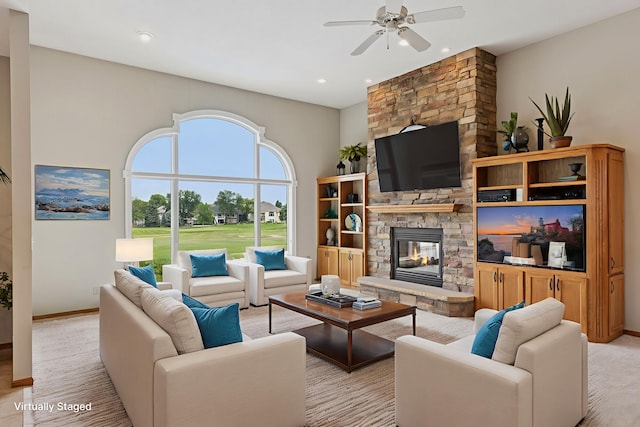 11565 Palisade Ct NE, Blaine, MN 55449 - living room featuring ceiling fan, a stone fireplace, and recessed lighting