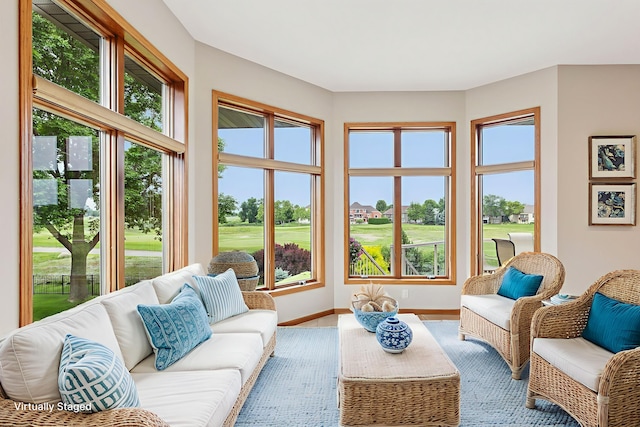 11565 Palisade Ct NE, Blaine, MN 55449 - living area featuring plenty of natural light, view of golf course, and wood finished floors
