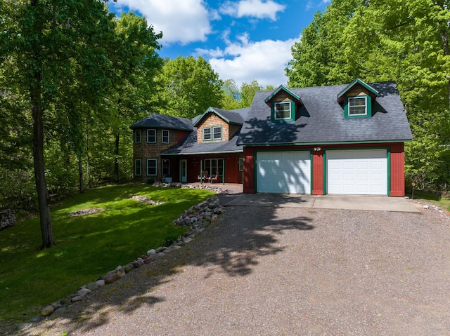 2706 28 1/8 St, Cedar Lake Twp, WI 54817 - view of front of property featuring a front lawn, gravel driveway, covered porch, and a garage