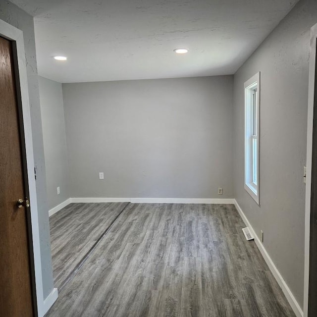 410 9th St, Morris, MN 56267 - empty room with wood finished floors, baseboards, and recessed lighting