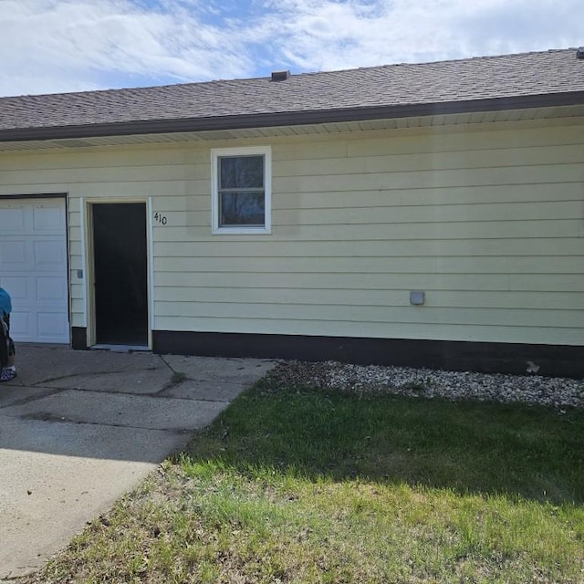 410 9th St, Morris, MN 56267 - view of property exterior featuring roof with shingles