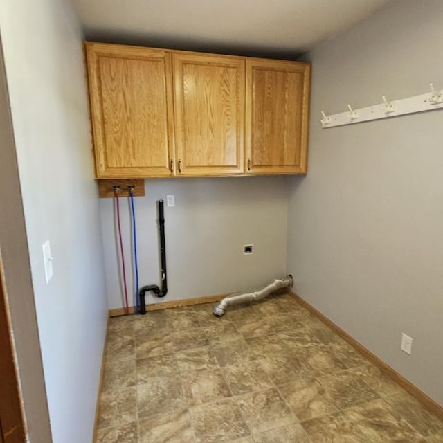 410 9th St, Morris, MN 56267 - laundry room with cabinet space, baseboards, and hookup for a washing machine