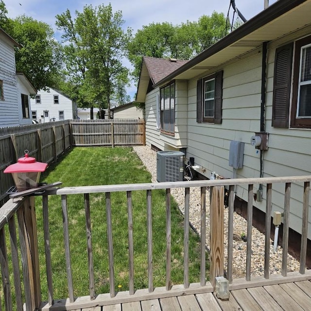 410 9th St, Morris, MN 56267 - view of yard featuring central AC and a deck