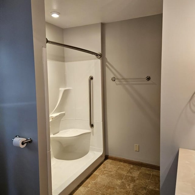 410 9th St, Morris, MN 56267 - bathroom with baseboards and a shower stall