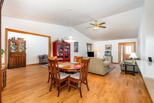 324 7th St NE, New Prague, MN 56071 - dining room featuring light wood-type flooring, ceiling fan, vaulted ceiling, plenty of natural light, and baseboards